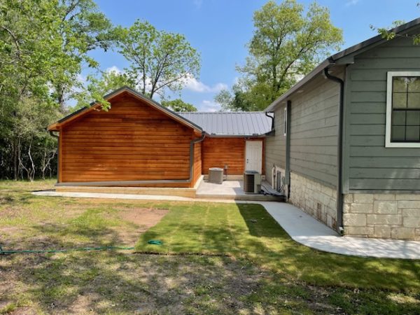 Log Cabin Style Home with Gutters & Downspouts - Tri County Guttering Waco, Texas