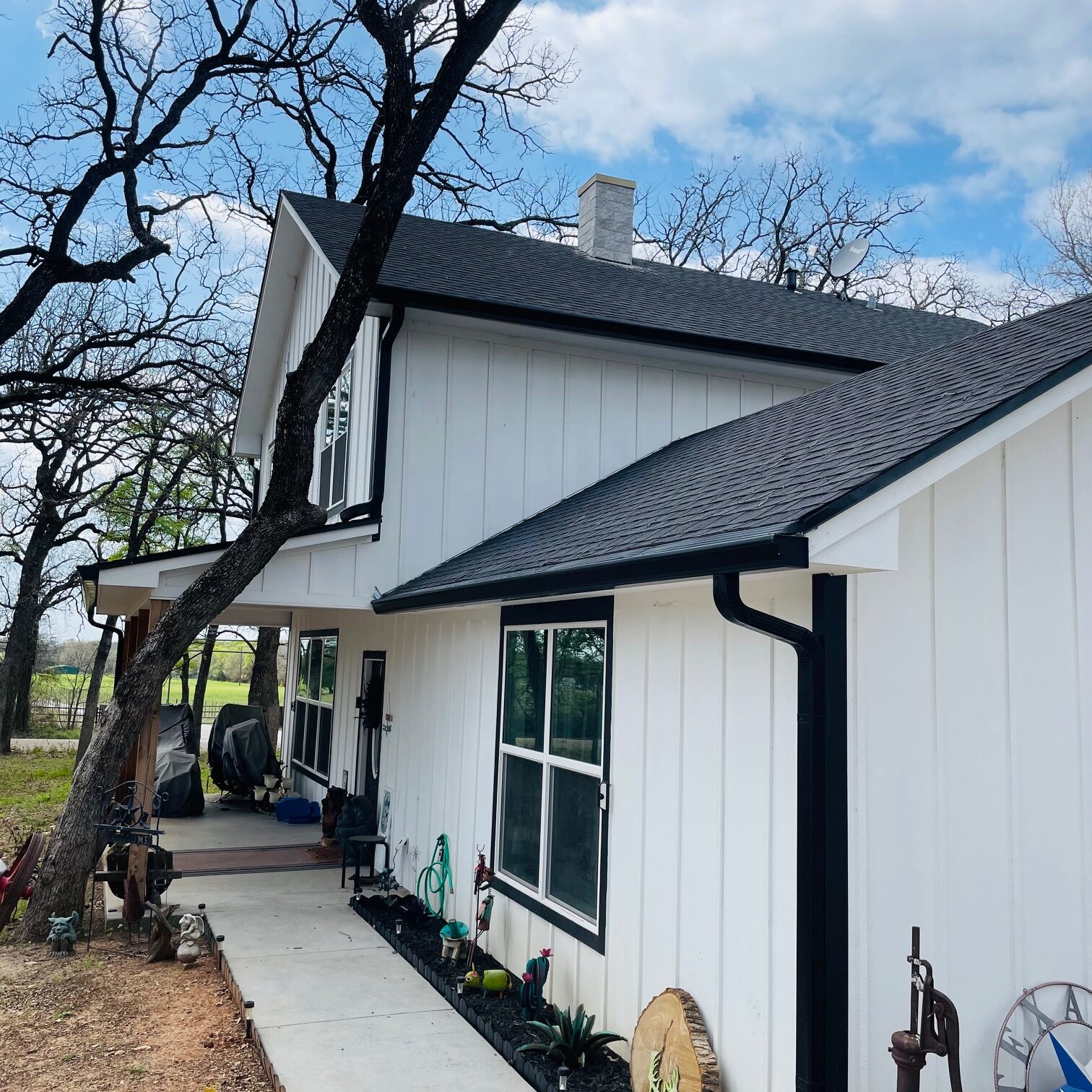 Tri-County Guttering Waco, Texas - White House with Black Gutters & Rain Spouts